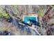 Image of a community pool with ample seating and a nearby playground at 1081 Talon Trce, Lawrenceville, GA 30043