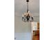 Dining room with decorative chandelier, tray ceiling, view of kitchen at 1081 Talon Trce, Lawrenceville, GA 30043