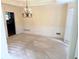 Traditional dining room featuring neutral decor, a decorative chandelier, and detailed wall trim at 1081 Talon Trce, Lawrenceville, GA 30043