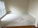 Bright, freshly painted empty room with neutral carpet and wood floors, ready for personal touches at 1081 Talon Trce, Lawrenceville, GA 30043