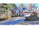 Charming two-story brick home with a well-maintained lawn and two car garage at 1081 Talon Trce, Lawrenceville, GA 30043