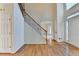 Inviting foyer with hardwood floors and a staircase featuring elegant metal balusters at 1081 Talon Trce, Lawrenceville, GA 30043