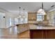 Kitchen features a granite-topped island and lots of cabinets at 1081 Talon Trce, Lawrenceville, GA 30043