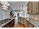 Spacious kitchen featuring hardwood floors, granite counters, and open access to the living area at 1081 Talon Trce, Lawrenceville, GA 30043