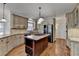 Kitchen features stainless steel appliances, custom cabinets, granite countertops, and hardwood floors at 1081 Talon Trce, Lawrenceville, GA 30043