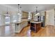 Gourmet kitchen featuring granite countertops, stainless appliances, and a large center island at 1081 Talon Trce, Lawrenceville, GA 30043