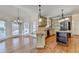 Kitchen featuring stainless steel appliances, granite countertops, gas cooktop island, and breakfast nook at 1081 Talon Trce, Lawrenceville, GA 30043