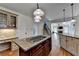 Open kitchen with a view of the living room and hardwood floors at 1081 Talon Trce, Lawrenceville, GA 30043