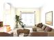 Bright living room showcasing a neutral color palette, large windows, and comfortable seating arrangement at 1081 Talon Trce, Lawrenceville, GA 30043