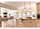 Open-concept living area adjoining the kitchen, featuring hardwood floors and natural light at 1081 Talon Trce, Lawrenceville, GA 30043