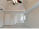Bright living room with neutral walls, vaulted ceiling, and modern ceiling fan at 1081 Talon Trce, Lawrenceville, GA 30043