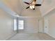 Spacious main bedroom with tray ceiling and large windows at 1081 Talon Trce, Lawrenceville, GA 30043