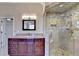 Shower showcases beautiful tile work and fixtures, as well as a glass door at 1081 Talon Trce, Lawrenceville, GA 30043