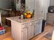 Kitchen island with granite countertop and storage, adjacent to stainless steel appliances at 1425 Parkmont Dr, Roswell, GA 30076