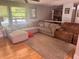 Living room featuring hardwood floors, a large window, and a comfortable sectional at 1425 Parkmont Dr, Roswell, GA 30076