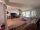 Spacious living room features hardwood floors, sectional sofa, entertainment center, and lots of light at 1425 Parkmont Dr, Roswell, GA 30076