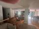 Open concept living space with kitchen and dining area, featuring hardwood floors and neutral paint at 1425 Parkmont Dr, Roswell, GA 30076