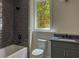 Bathroom with tub, shower and single sink vanity at 2461 Fernleaf Nw Ct, Atlanta, GA 30318