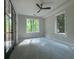 An empty room with natural light and a ceiling fan at 2461 Fernleaf Nw Ct, Atlanta, GA 30318