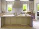 Spacious kitchen island with counter seating, undermount sink, and pendant lighting above at 2461 Fernleaf Nw Ct, Atlanta, GA 30318