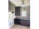 Well-appointed mudroom with custom cabinets, dark countertops, and modern lighting at 2461 Fernleaf Nw Ct, Atlanta, GA 30318
