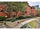 Brick building with lush greenery and trees at 273 12Th Ne St # 313, Atlanta, GA 30309