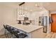 Modern kitchen with stainless steel appliances, white cabinetry, and a large kitchen island at 273 12Th Ne St # 313, Atlanta, GA 30309