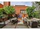 Private outdoor patio with dining area, lounge seating, grill, and water feature offers inviting space at 273 12Th Ne St # 313, Atlanta, GA 30309