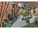 Beautiful exterior walkway showcasing manicured garden and traditional brick building at 273 12Th Ne St # 313, Atlanta, GA 30309