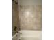 Clean bathroom featuring a bathtub with tile surround and chrome fixtures at 3472 Riverview Chase Way, Ellenwood, GA 30294