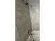 Close-up view of the bathroom tile and shower head at 3472 Riverview Chase Way, Ellenwood, GA 30294