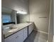 Bathroom featuring granite countertops, double sinks and tile floors at 3472 Riverview Chase Way, Ellenwood, GA 30294