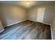 Bedroom featuring hardwood floors and natural light from a window at 3472 Riverview Chase Way, Ellenwood, GA 30294