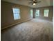 Spacious bedroom featuring a ceiling fan, neutral walls and carpet at 3472 Riverview Chase Way, Ellenwood, GA 30294
