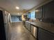 Spacious kitchen with stainless steel appliances, granite countertops, and dark cabinets, perfect for entertaining at 3472 Riverview Chase Way, Ellenwood, GA 30294