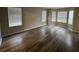 Bright living room featuring hardwood floors, bay windows, and neutral paint, perfect for relaxing at 3472 Riverview Chase Way, Ellenwood, GA 30294