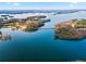 Breathtaking aerial view of the lake, complete with islands and a bridge, highlighting the area's natural beauty at 6337 Ansel Ct, Buford, GA 30518