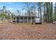 Backyard featuring a screened-in porch, shed, and ample outdoor space at 6337 Ansel Ct, Buford, GA 30518