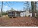 View of the spacious screened-in porch with a storage shed in the backyard at 6337 Ansel Ct, Buford, GA 30518