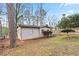 Charming backyard featuring a quaint outbuilding and well-maintained lawn, perfect for outdoor enjoyment at 6337 Ansel Ct, Buford, GA 30518