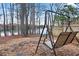 Relaxing backyard with a comfortable swing, perfect for enjoying nature and the lake views at 6337 Ansel Ct, Buford, GA 30518