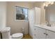Bright bathroom featuring a single sink vanity and tile flooring at 6337 Ansel Ct, Buford, GA 30518