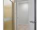Bathroom features a shower with glass door at 6337 Ansel Ct, Buford, GA 30518