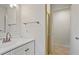 Bright bathroom featuring a single sink vanity and tile flooring at 6337 Ansel Ct, Buford, GA 30518