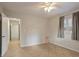 Bedroom features neutral paint, tile flooring, and a ceiling fan at 6337 Ansel Ct, Buford, GA 30518