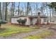 Charming front exterior of a cozy home with a stone chimney and well-maintained yard at 6337 Ansel Ct, Buford, GA 30518