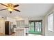 Bright kitchen with modern appliances, white cabinets, and an island with seating at 6337 Ansel Ct, Buford, GA 30518