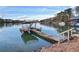 Lakefront dock featuring a unique two-tiered platform for enjoying the lake view at 6337 Ansel Ct, Buford, GA 30518