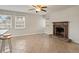 Bright living room featuring a fireplace, tile floors, and natural light at 6337 Ansel Ct, Buford, GA 30518