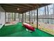 A cozy screened porch with a canoe and lake views for outdoor enjoyment at 6337 Ansel Ct, Buford, GA 30518